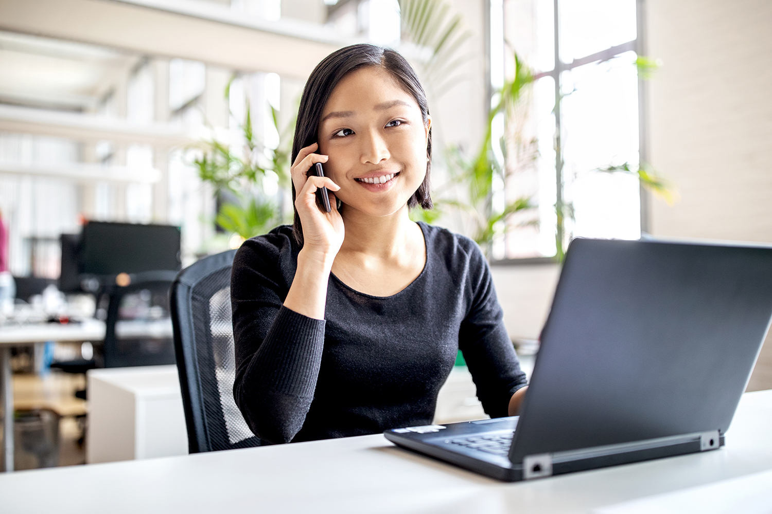 Female Professional Working In Modern Office